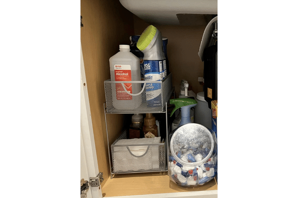 Using Huntington Home 2 Tiered Mesh Organizer under the Counter to keep First Aid and Cleaning Essentials